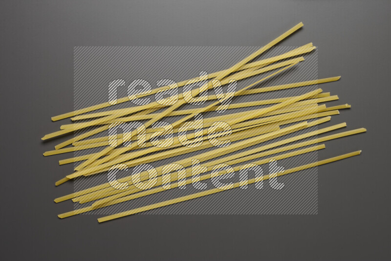 Linguini pasta on grey background
