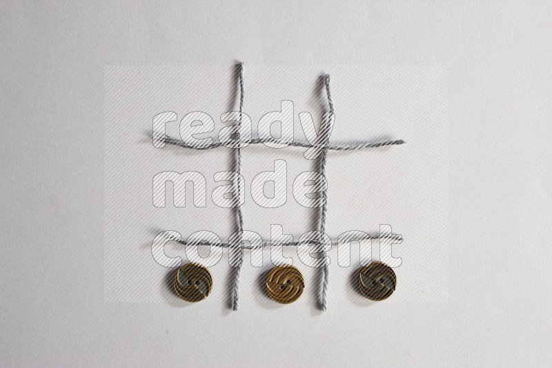 Metal buttons on grey background