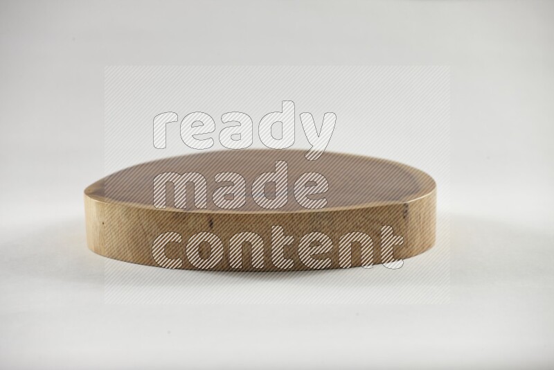 A circular wooden slab with natural textures on white background