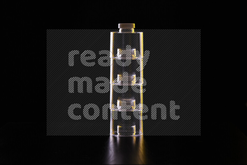 Glassware with rim light in yellow and white against black background