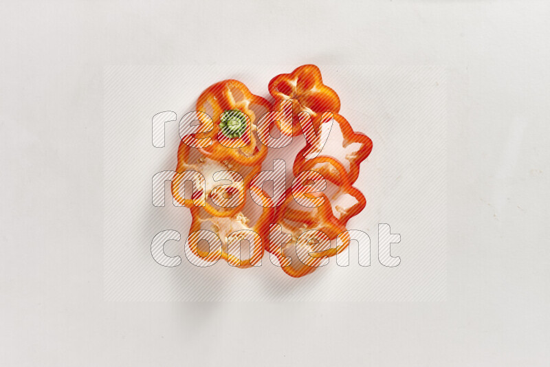 Red bell pepper slices on white background