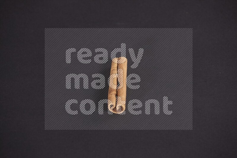 Cinnamon stick on black background