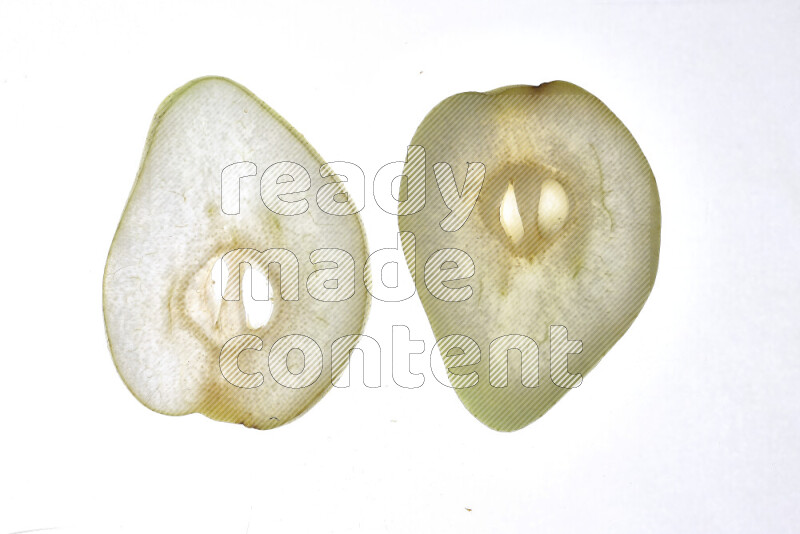 Pear slices on illuminated white background