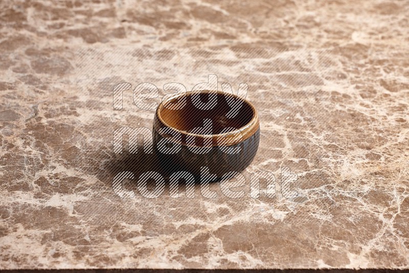 Multicolored Pottery Bowl on Beige Marble Flooring