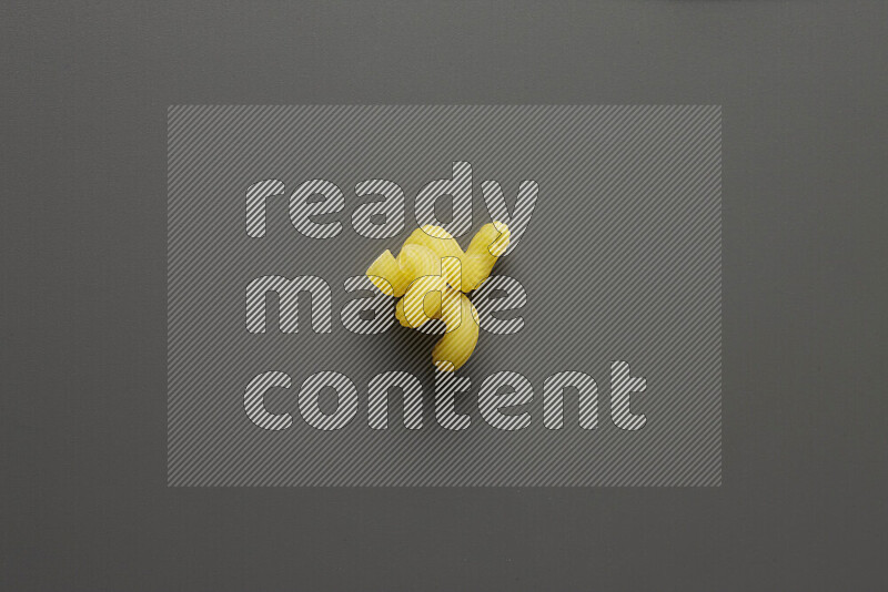 Twist pasta on grey background