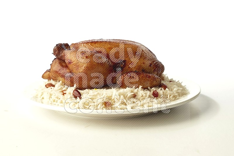 white  basmati Rice with  whole roasted chicken  on a white rounded plate direct on white background