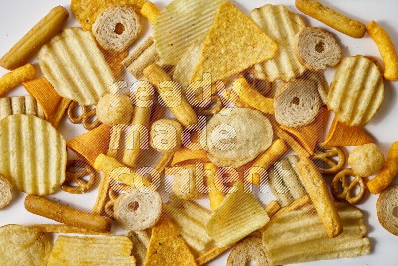 Assorted snacks on white background