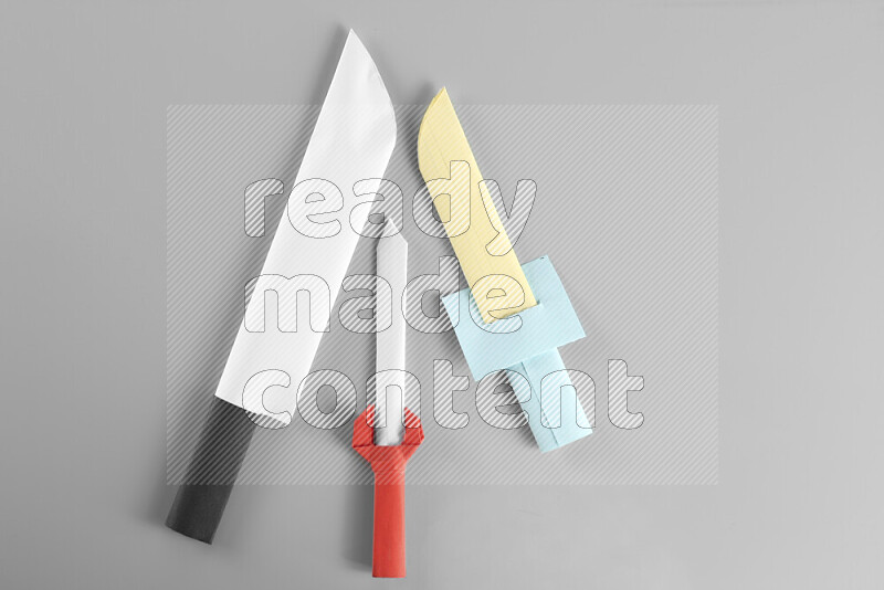 Origami sword on grey background