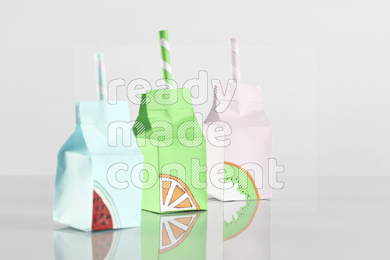 Origami juice box on grey background