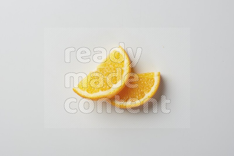 Two halves of an orange slices on white background