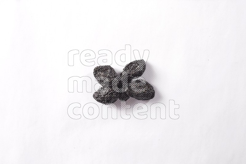 Dried plums on white background