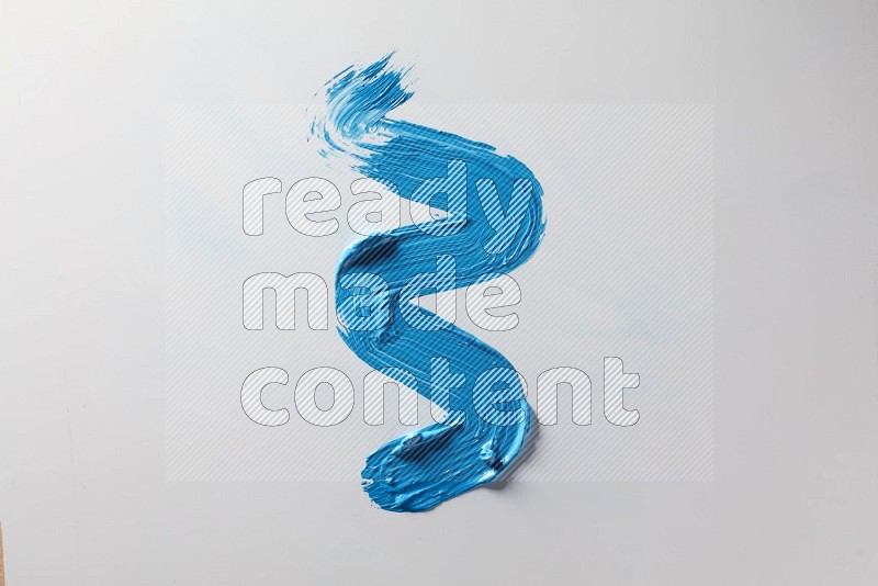 A single blue zigzag brush stroke on a white background