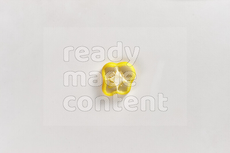 Yellow bell pepper slices on white background