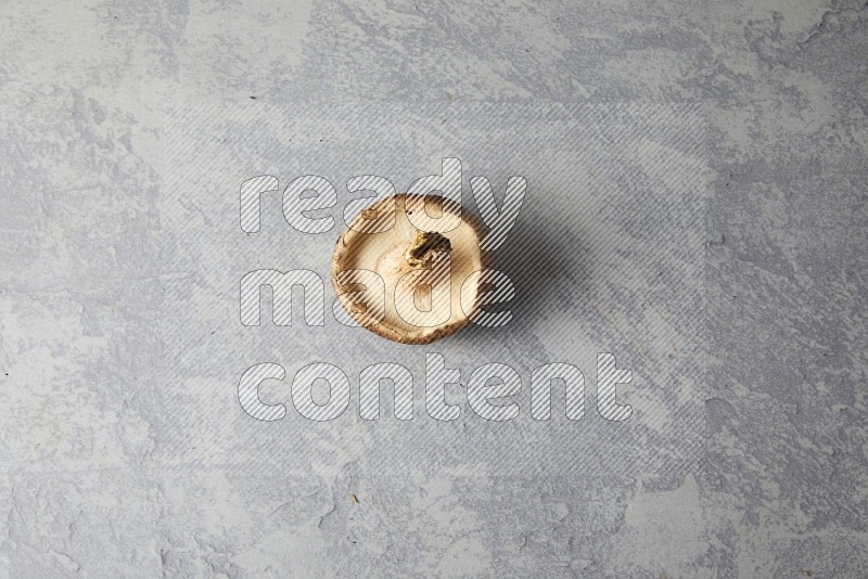 fresh shiitake Mushrooms topview on a light blue textured background