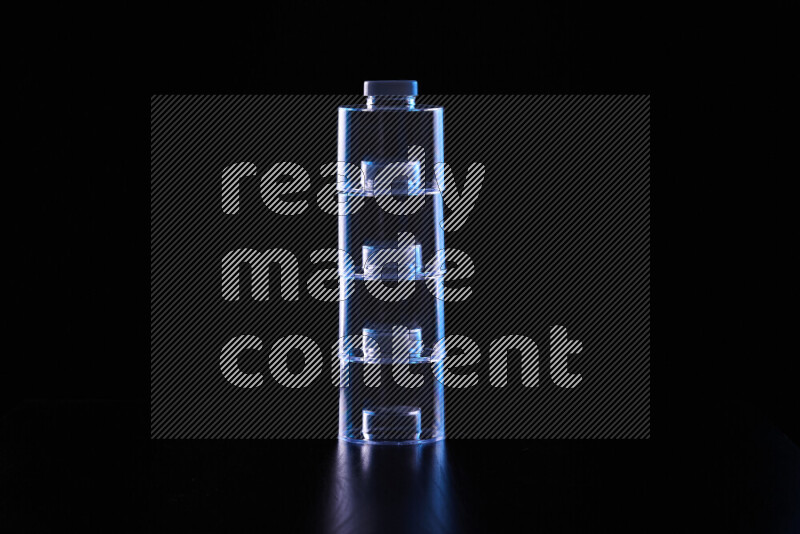 Glassware with rim light in blue and white against black background