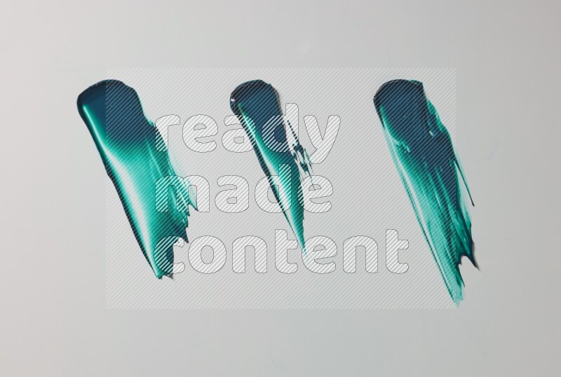 Turquoise painting knife strokes on white background