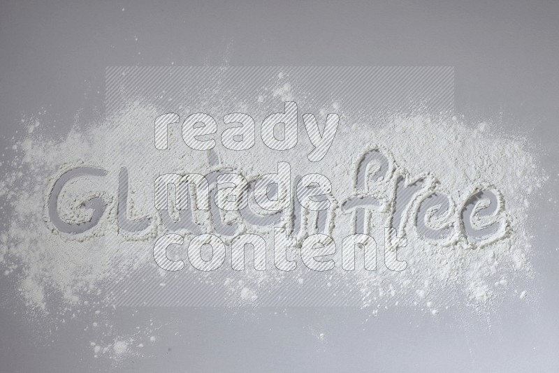 A sentence written with powder on grey background