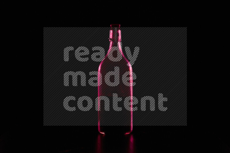 Water bottle with colored rim light against black background