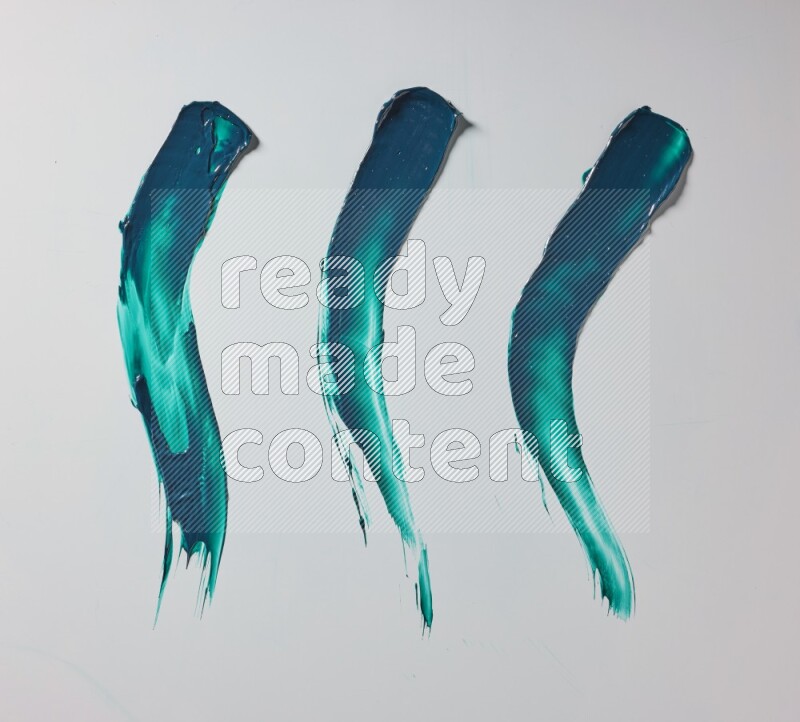 Turquoise painting knife strokes on white background