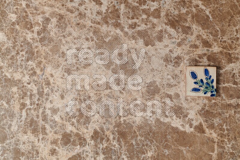 A decorative coaster on beige marble background