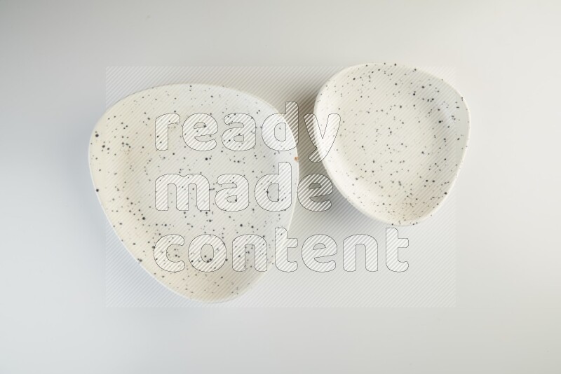 white plate with black dots on white background