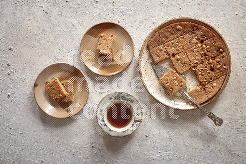 Basbousa with tea in a light setup