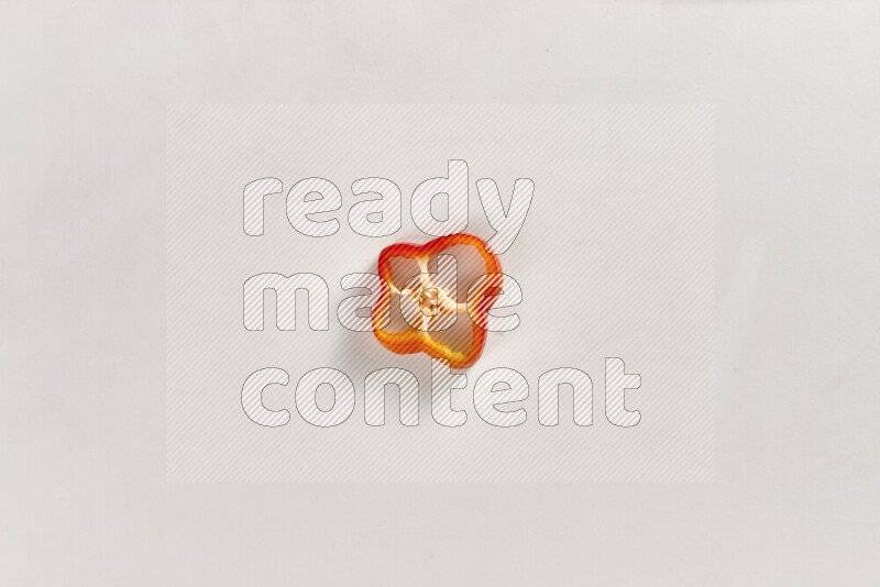 Red bell pepper slices on white background