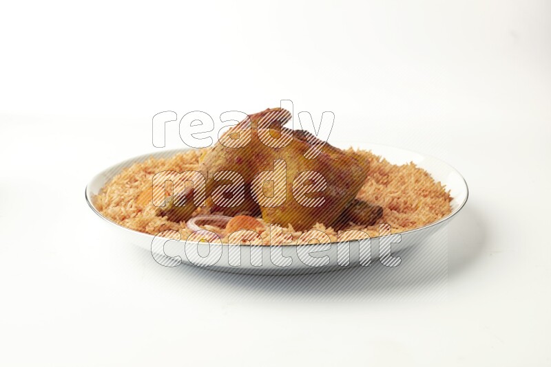 red basmati Rice with  kabsa chicken pieces on a white plate with a silver rim direct  on white background