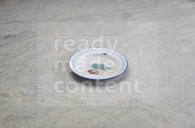 A vintage metal plate on grey marble background