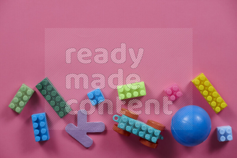 Plastic building blocks with balls on different colored background (kids toys)