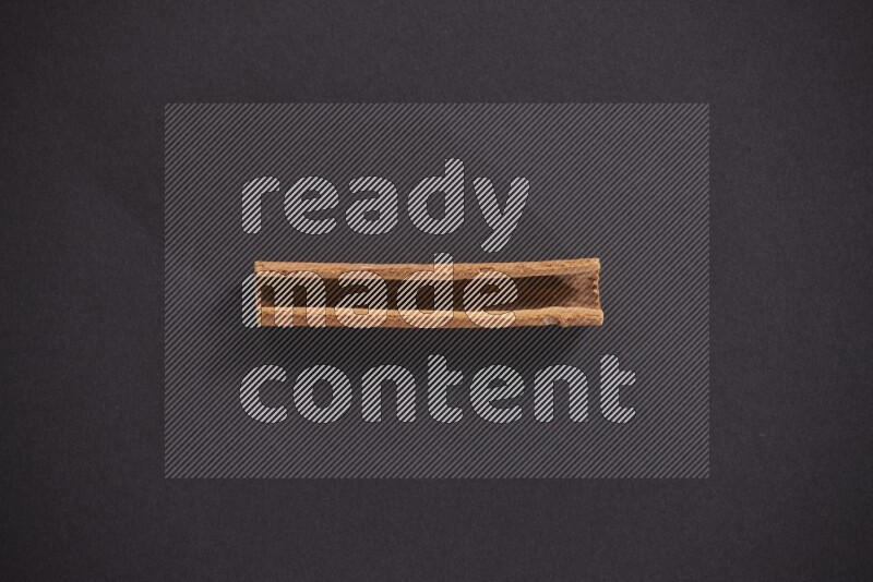 Cinnamon stick on black background