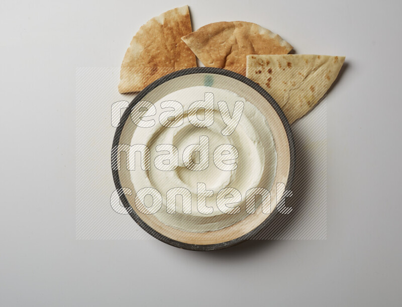 plain Lebnah in a pottery plate on a white background