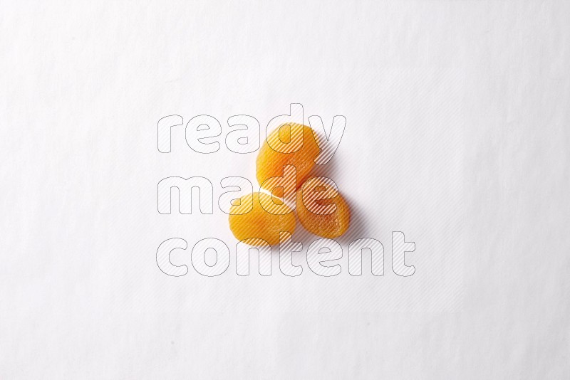 Dried apricots on white background