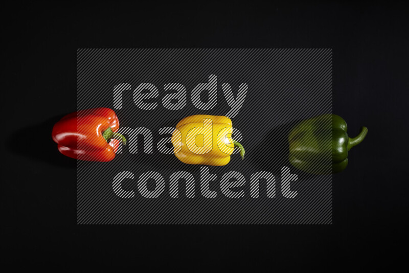 Assorted bell pepper on black background