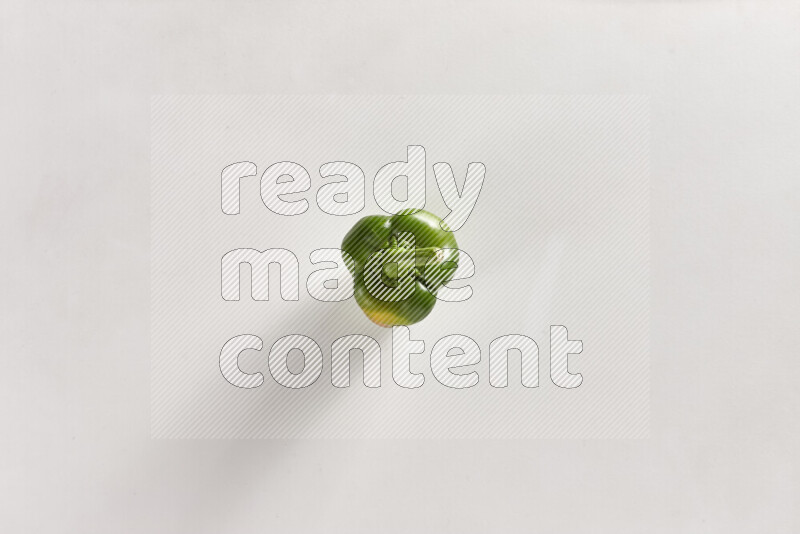 Green bell pepper on white background