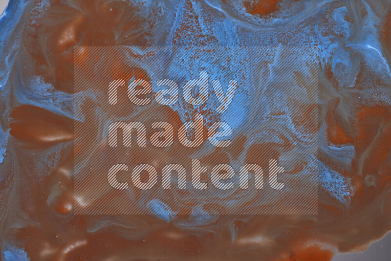 خلفية ملونة مع مزيج من ألوان الطلاء البرتقالي والأزرق