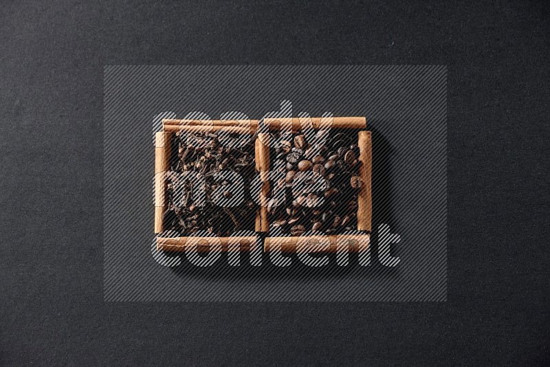 2 squares of cinnamon sticks full of coffee beans and cloves on black flooring