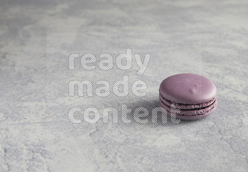 45º Shot of Purple Blueberry macaron on white  marble background