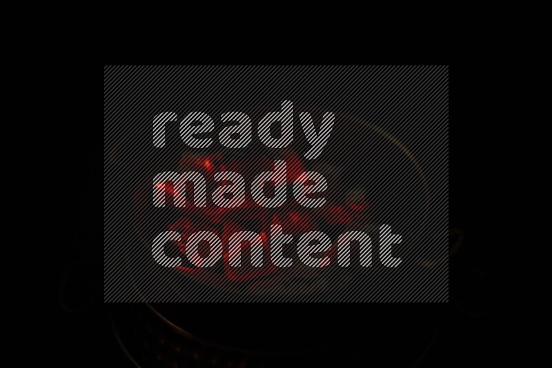 Coal cubes on fire in metal pan