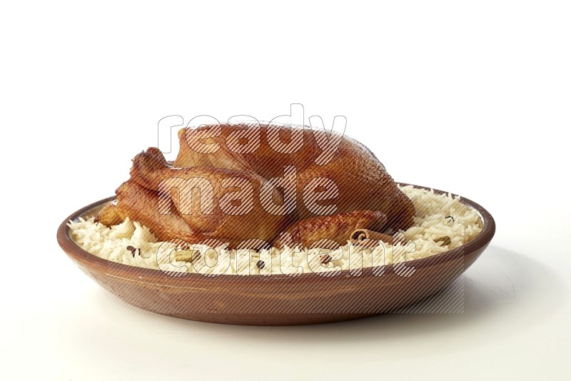 white  basmati Rice with  whole roasted chicken    on a pottery plate  direct  on white background