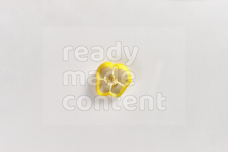 Yellow bell pepper slices on white background