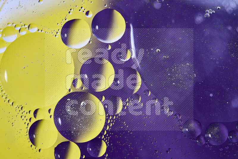 Close-ups of abstract oil bubbles on water surface in shades of purple and yellow