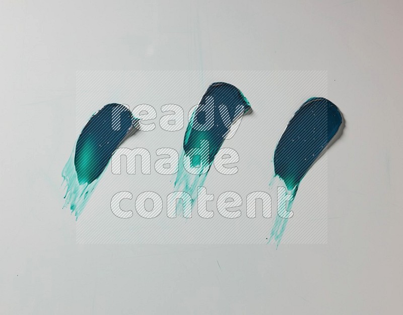 Turquoise painting knife strokes on white background