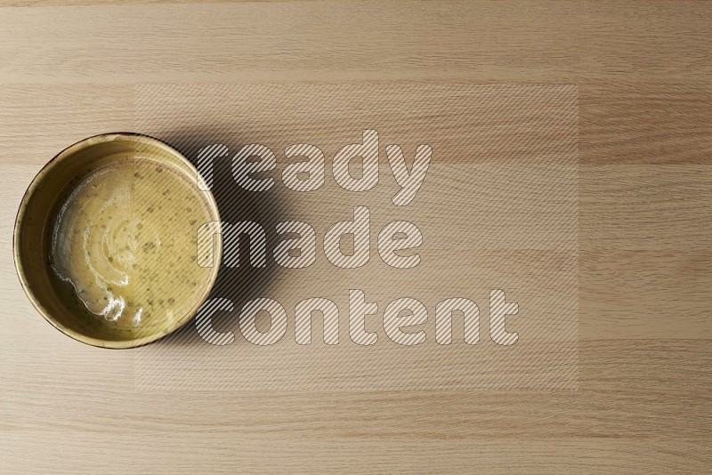 Top View Shot Of A Multicolored Pottery Oven Plate on Oak Wooden Flooring