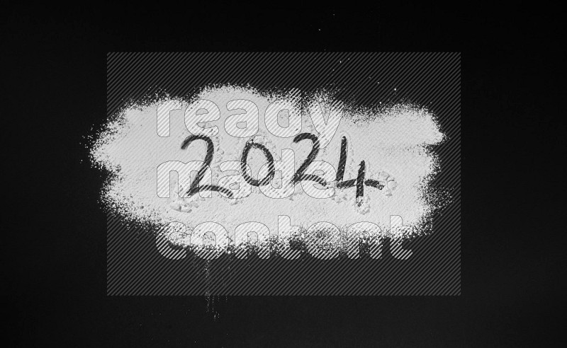 Numbers written with powder on black background