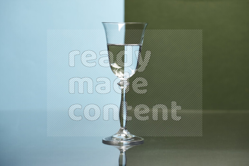 The image features a clear glassware filled with water, set against light blue and dark green background