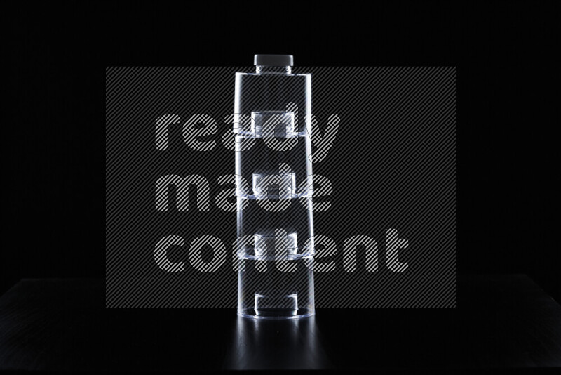 Glassware with rim light against black background