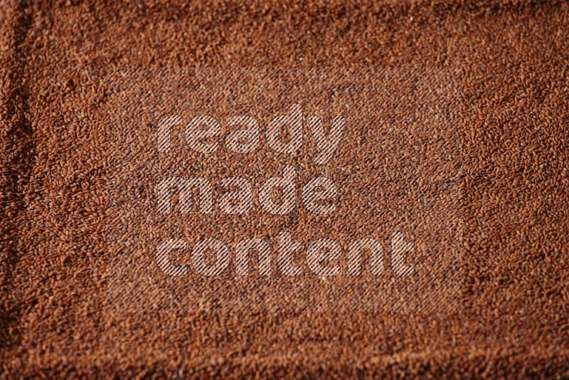 Garden cress seeds filling the frame on a black flooring