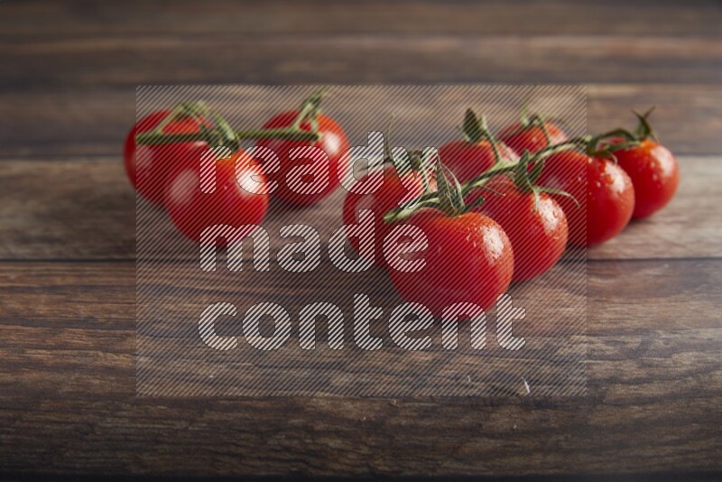 Red cherry tomato vein on a textured wooden background 45 degree