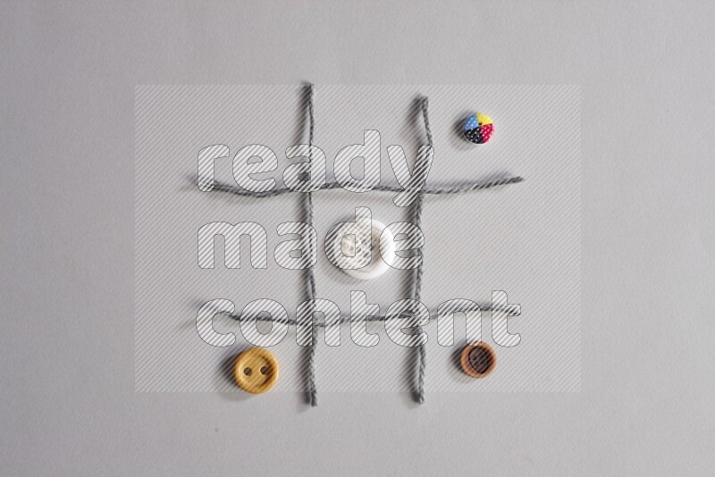 Multicolored buttons placed on grey background